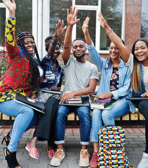 group-five-african-college-students-spending-time-together-campus-university-yard-black-afro-friends-studying-bench-with-school-items-laptops-notebooks_627829-6042