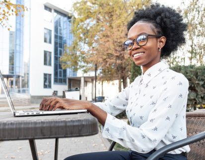 side-view-woman-working-electronic-device_23-2148353551